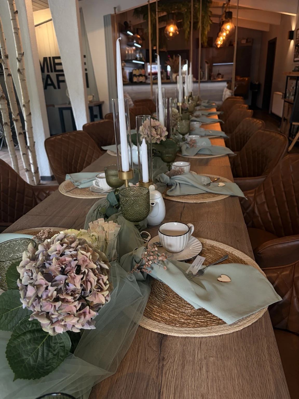 Flowers and dishes on a bright banquet table in the Schmiedehafen