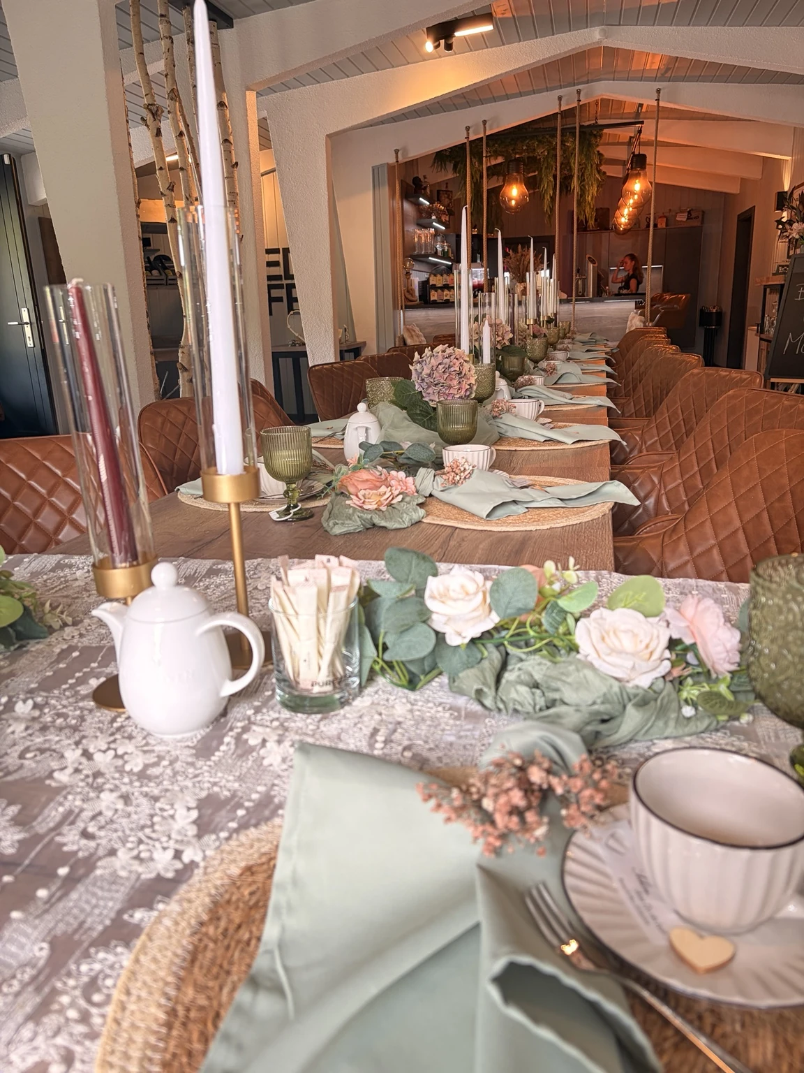 Festively set table with flowers and candles in the Schmiedehafen